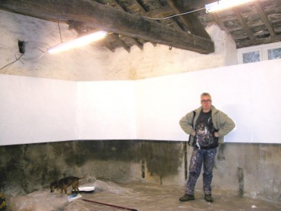 Artist John Baldwin in the Shippon, after helping to paint the display panels. February 2007.