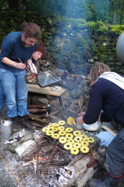 Christine Dixon and Miki Zed of 'The Travelling Hearth organising the outdoor cooking for the 2012 Summer School.