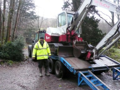 Contractor Mike Edmondson arriving to start work on the Merz Barn drainage system. Note the newness of his jacket and the digger!